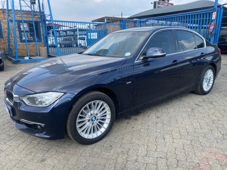
								13 BMW 320i full									